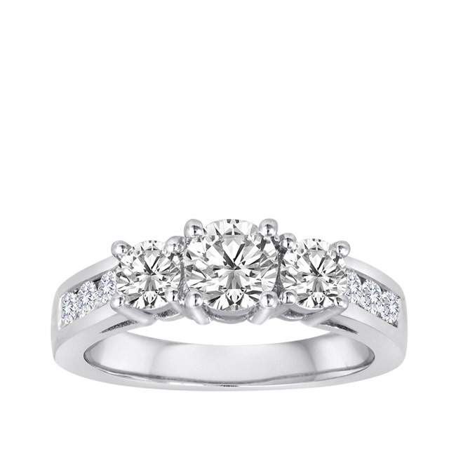 white gold three stone round prong set diamond ring with channel set melee diamonds